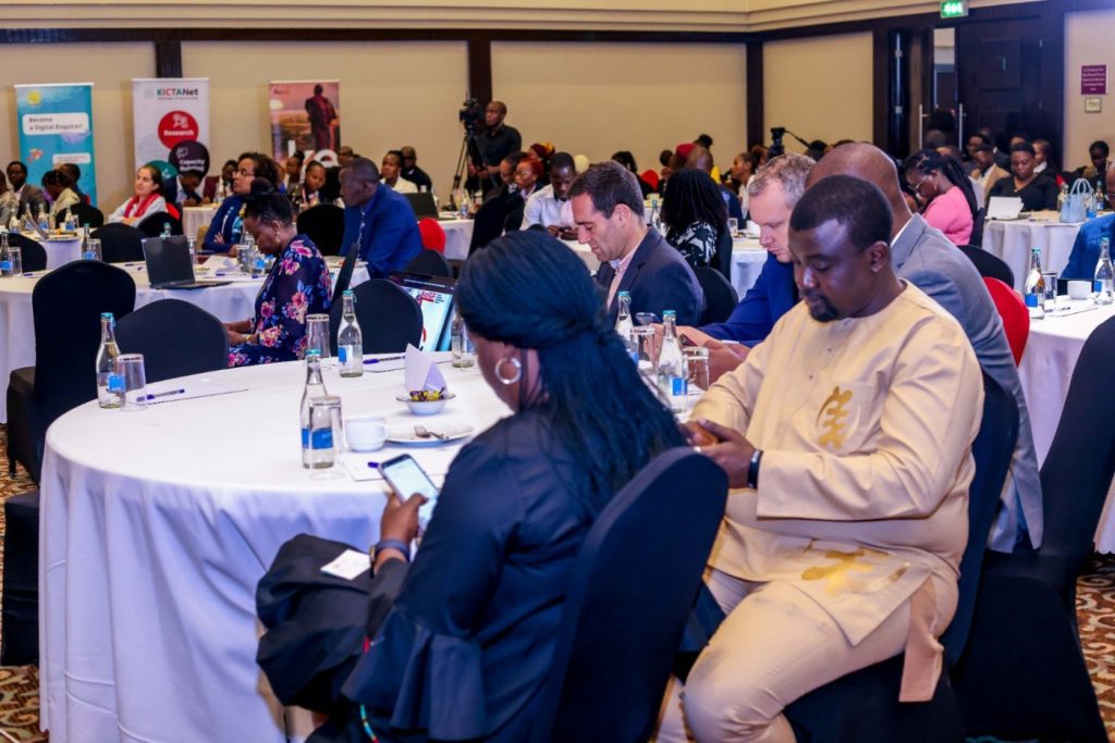 Guests of the Kenya IGF seated in a large room on round tables.