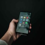 Man scrolling social media platforms on a smart phone