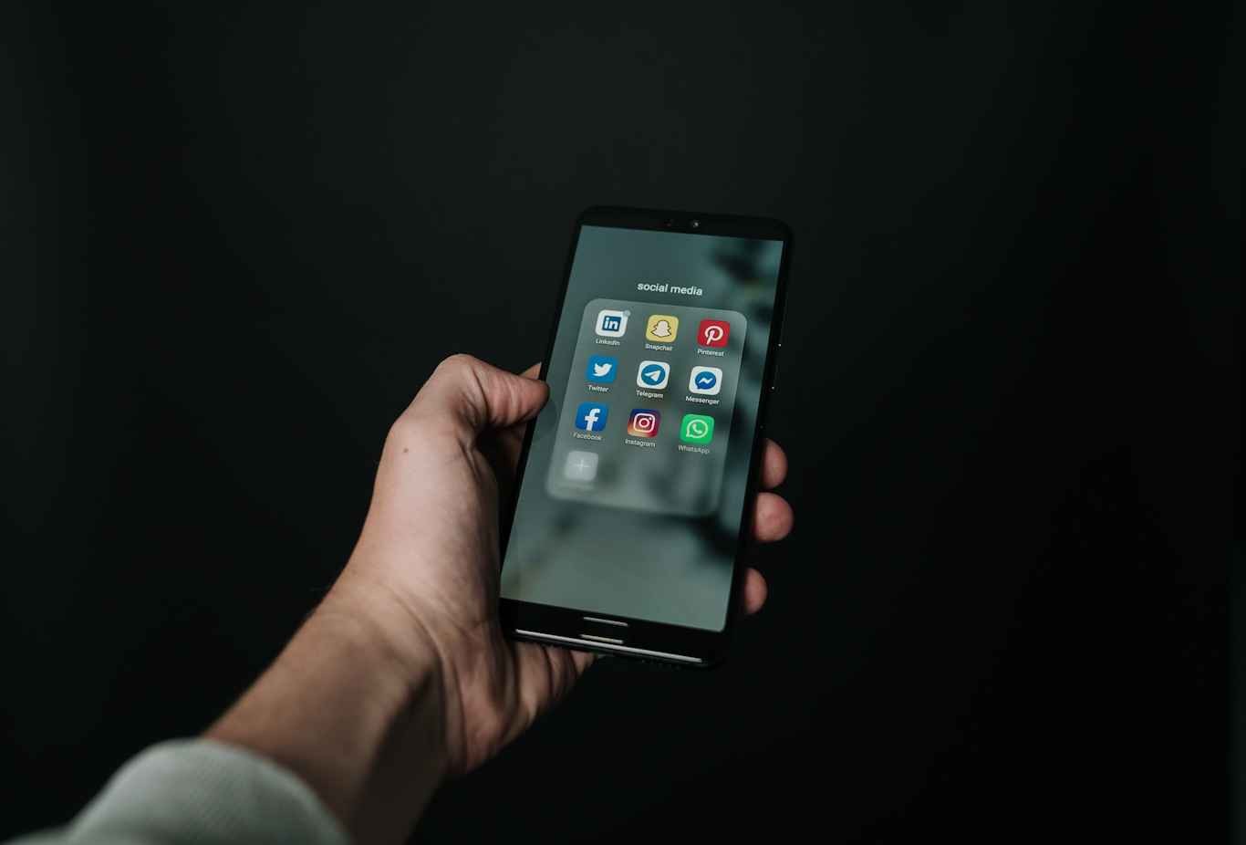 Man scrolling social media platforms on a smart phone