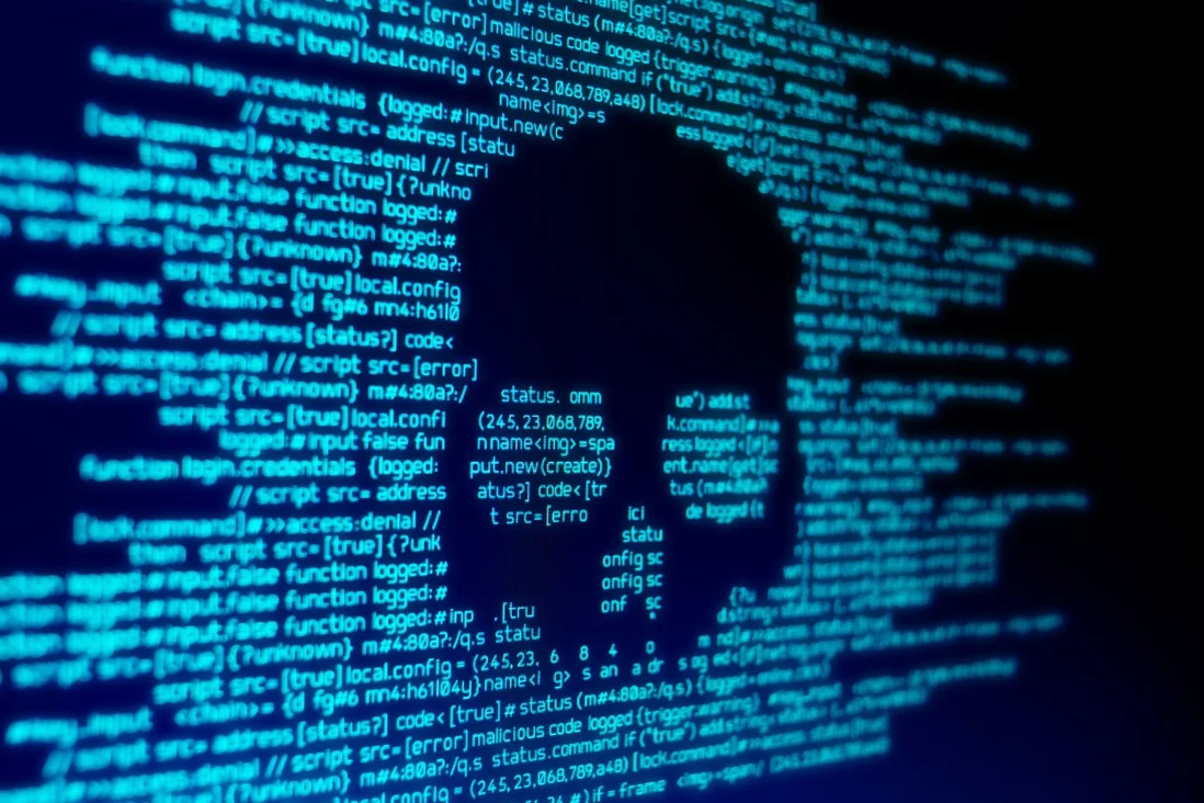 Computer code seen on a screen with a skull representing a computer virus attack. Photo: Shutterstock Images