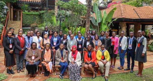 Participants pose for a photo in an event organised by Equality now to discuss the implementation of laws relating to tech-facilitated sexual exploitation and abuse in Kenya.