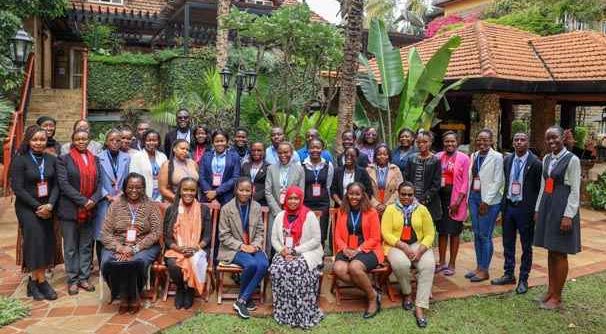 Participants pose for a photo in an event organised by Equality now to discuss the implementation of laws relating to tech-facilitated sexual exploitation and abuse in Kenya.