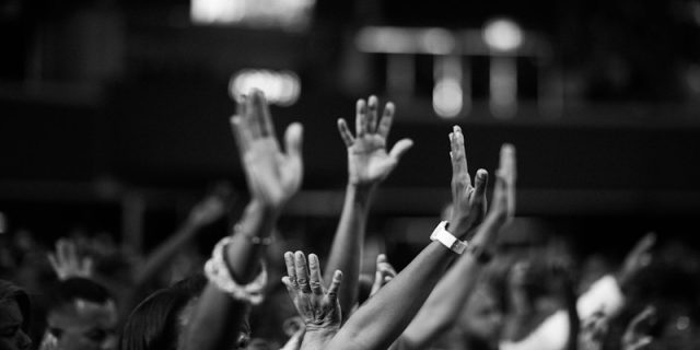 Photo showing people raising hands up PHOTO | https://www.pexels.com/@jibarofoto