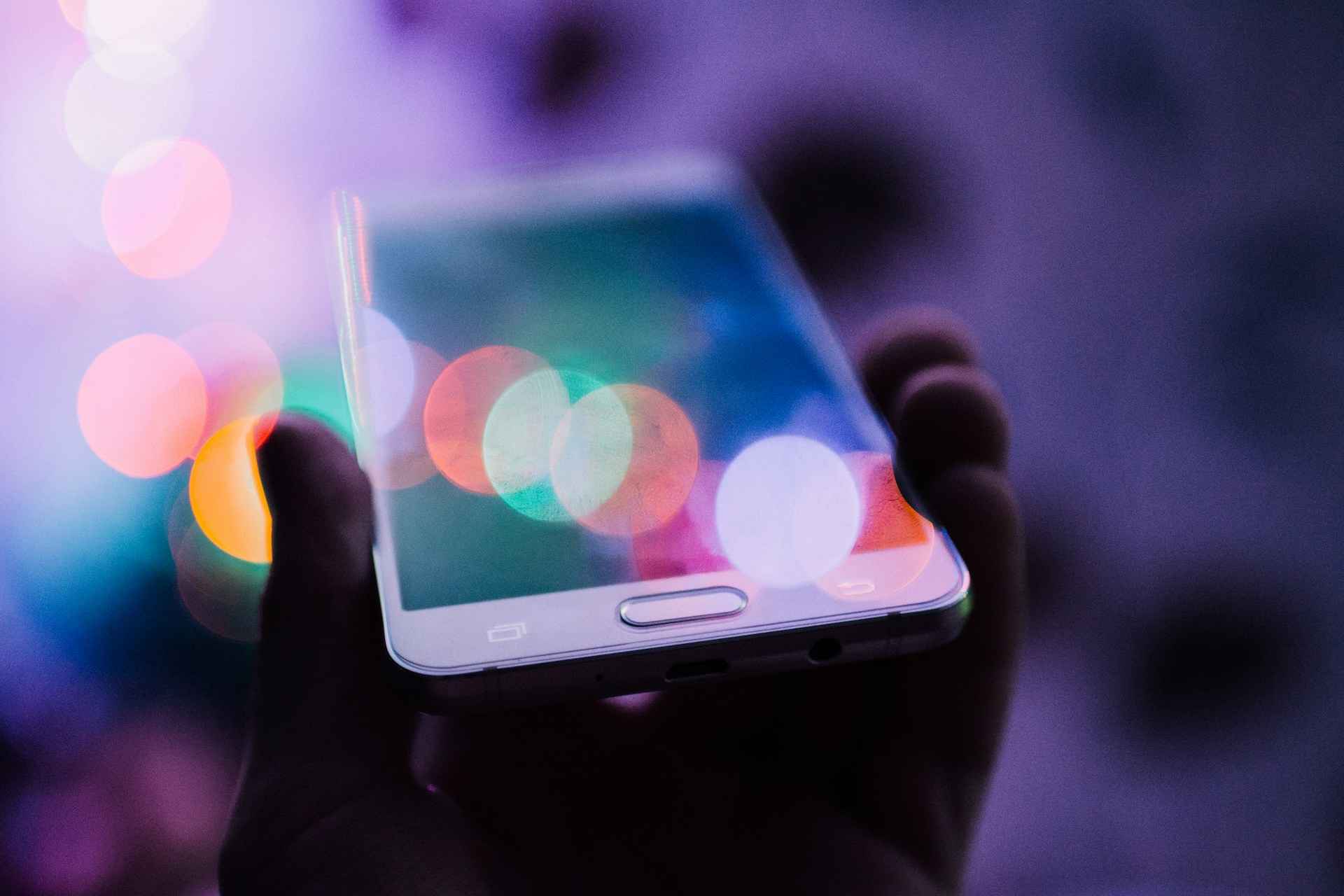 Man holding a mobile phone. Digital Rights Under Threat in Africa: Activists Fight for Free Speech
