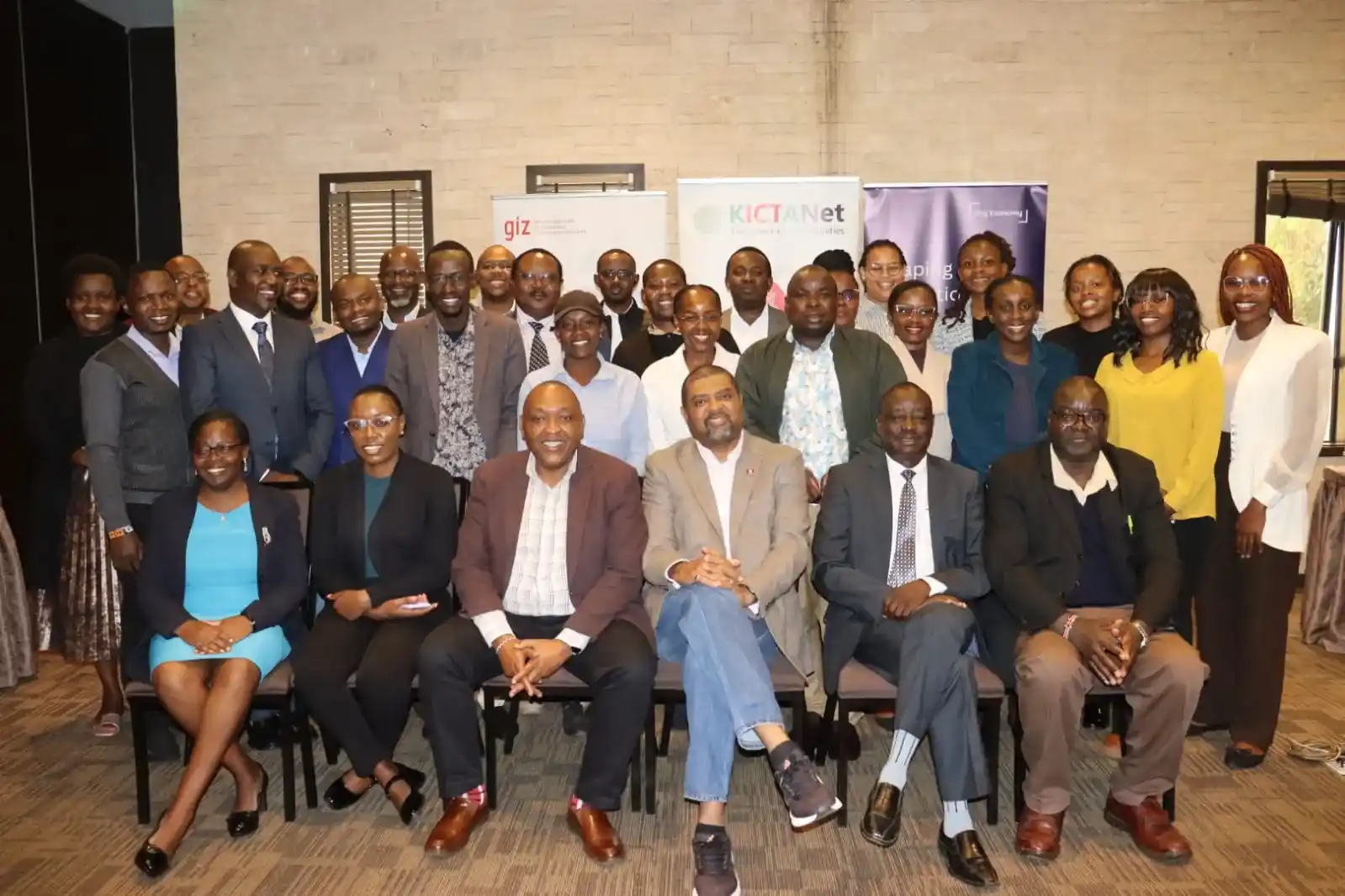 Participants in a group photo during the Policy Consultation Roundtable on Regulating Kenya’s Gig Economy, convened by GIZ and KICTANet